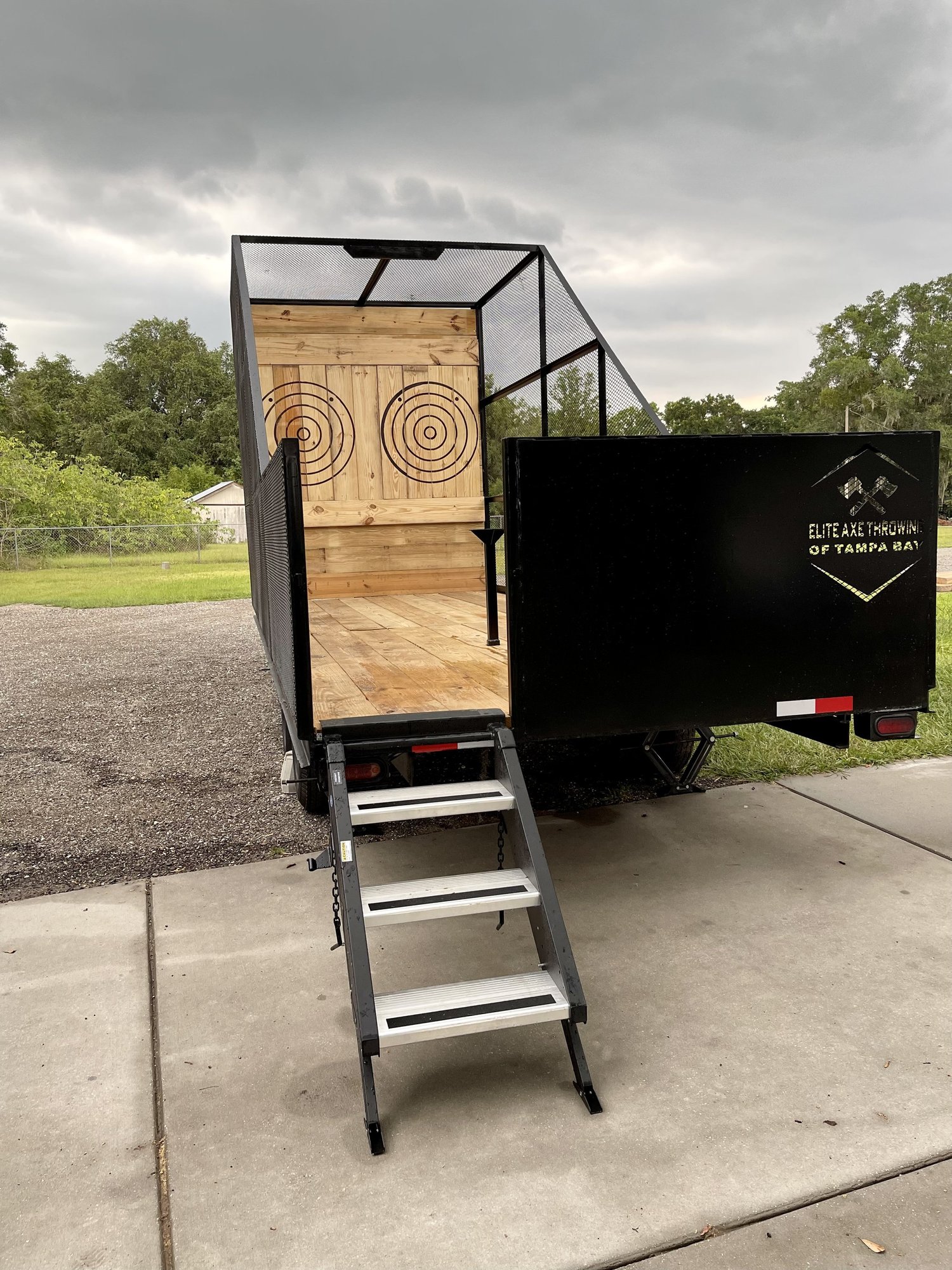 Elite Axe Throwing’s mobile trailer, with enclosed target lanes and entrance steps